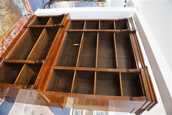 A Victorian figured walnut inverse breakfront library bookcase, W.6ft 1in. D.1ft 4in. H.7ft 6in.